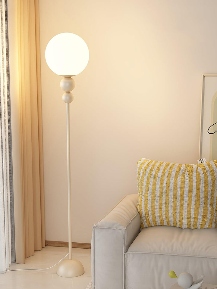 Modern green accent lamp, metal base with elegant glass shade, for any indoor setting.