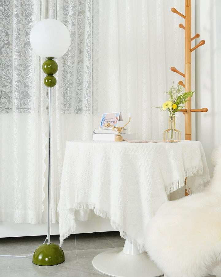 Ambient green metal & glass floor lamp, offering stylish lighting for contemporary spaces.