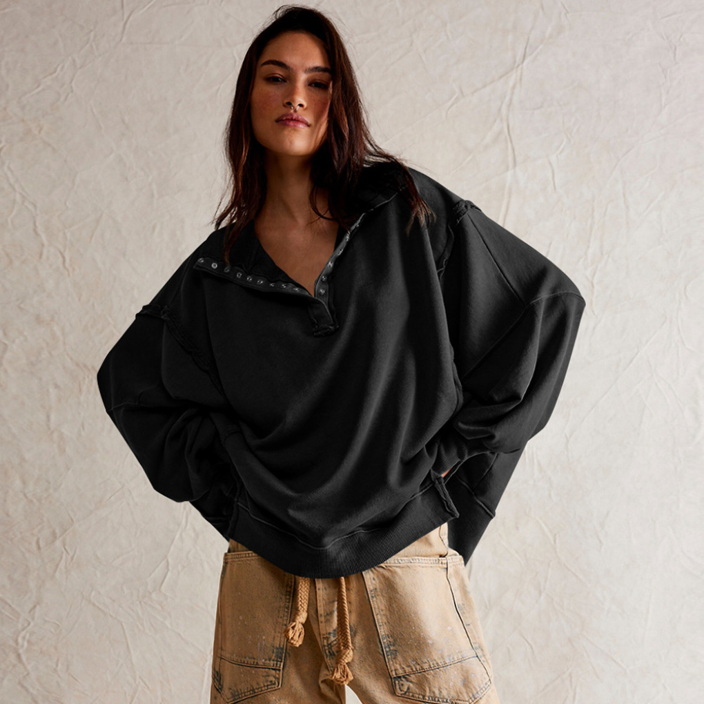 Casual women's oversized henley pullover with long sleeves and stylish high-low hem, relaxed fit.