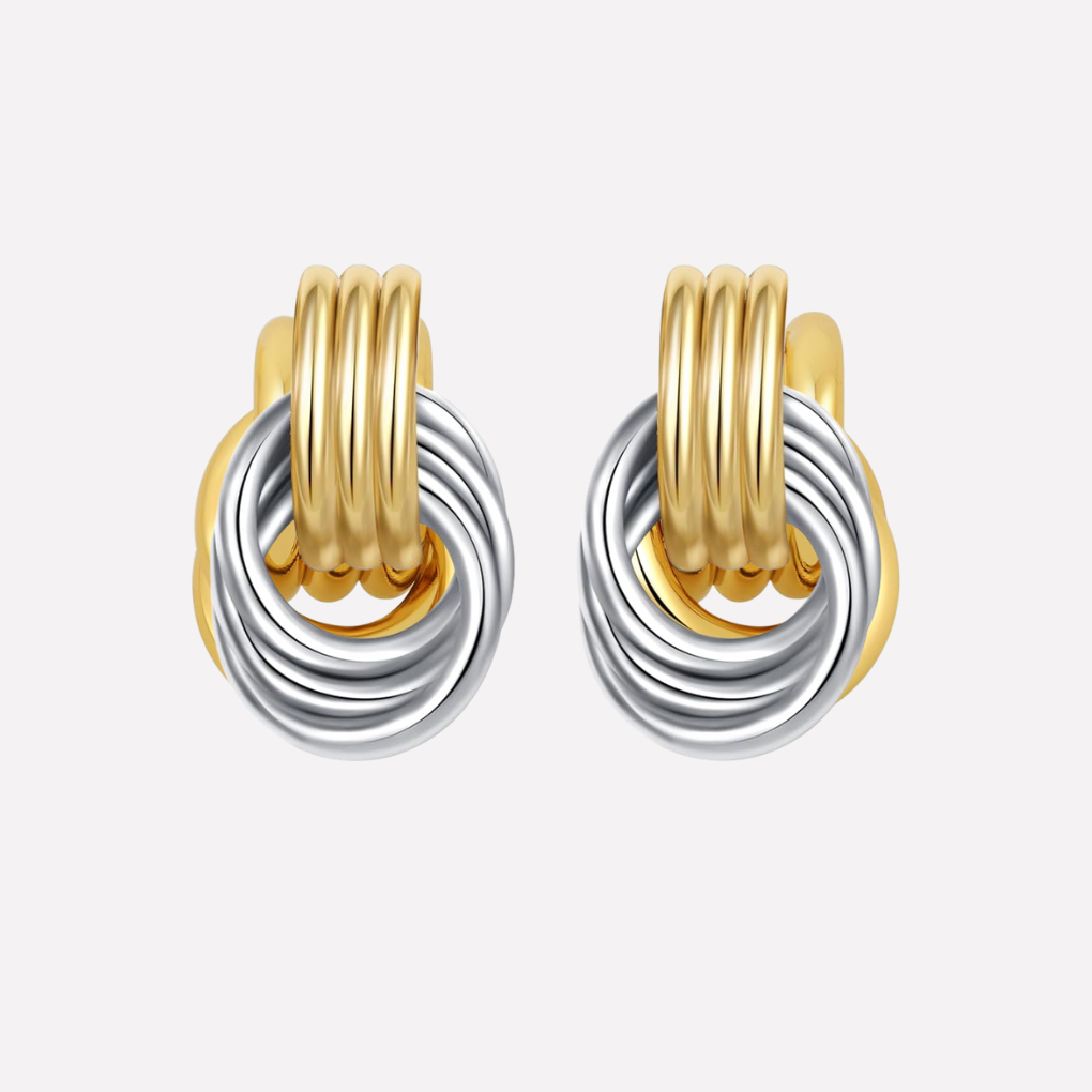 Silver tone drop earrings featuring a unique knot design, perfect for gifting.