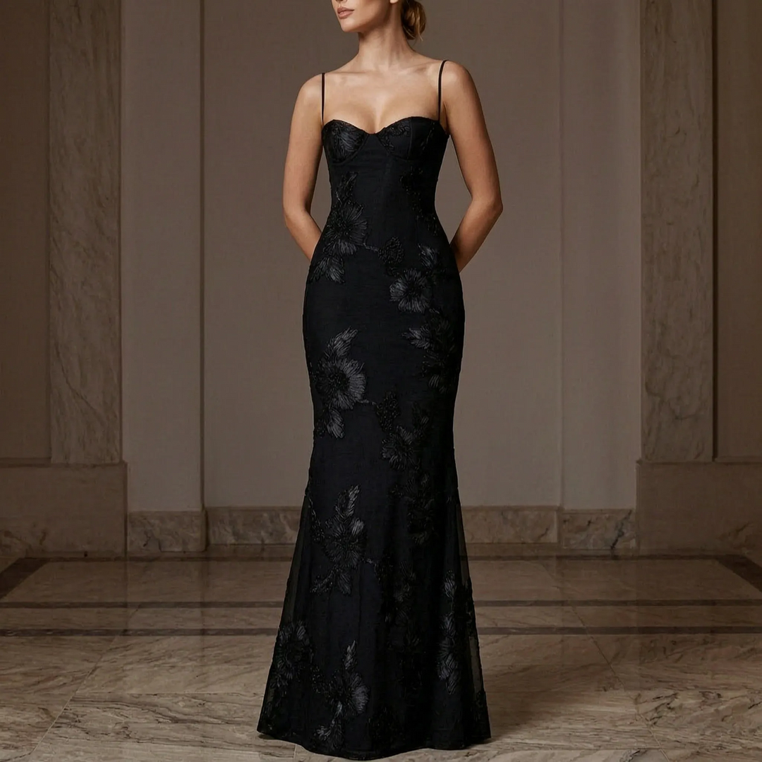 Women's fitted floral appliqué maxi evening dress with spaghetti straps, perfect for formal occasions.