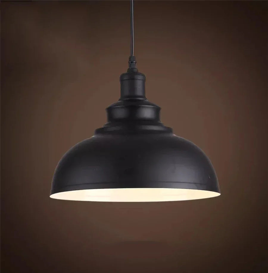 Dark iron pendant light, farmhouse rustic design, great for kitchen or dining room decor.