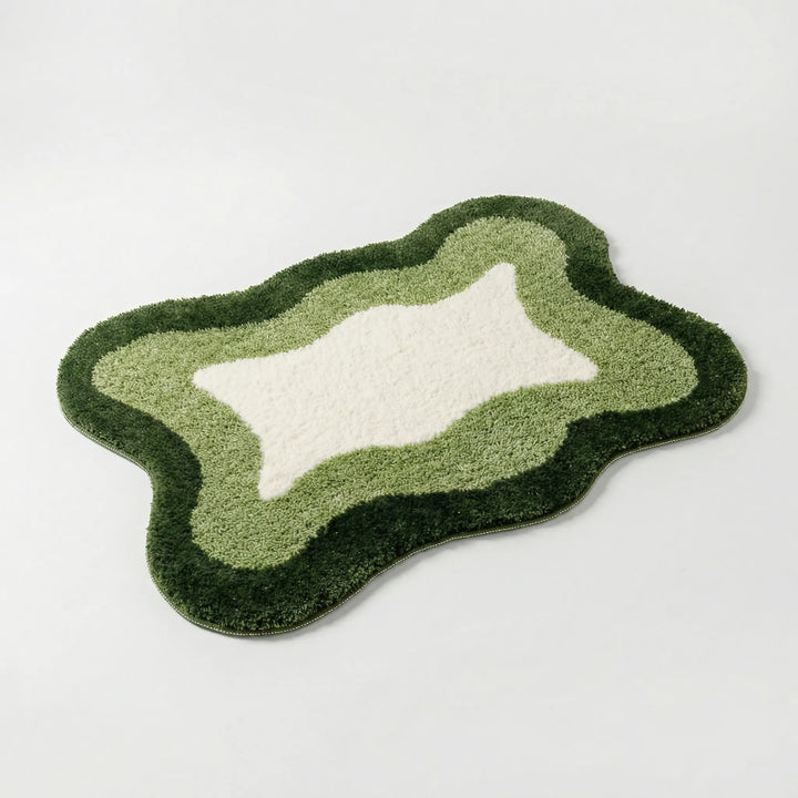 Elegant Flowique wave pattern bath rug. A soft, absorbent, and non-slip luxury accent for modern home decor.