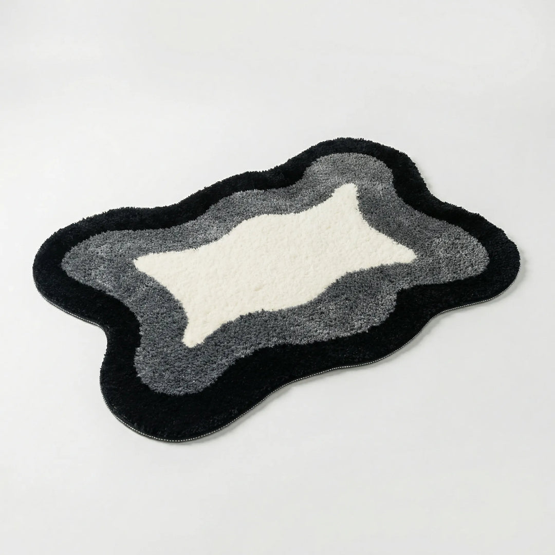 Modern Flowique wave area rug. This luxury non-slip bath mat provides enhanced safety and soft comfort.