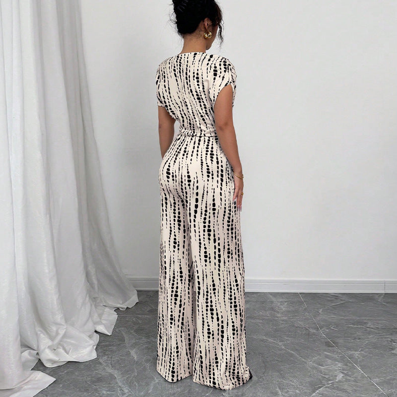 Stylish women's one-shoulder printed jumpsuit. Features a wide leg and belt, ideal for special occasion fashion.