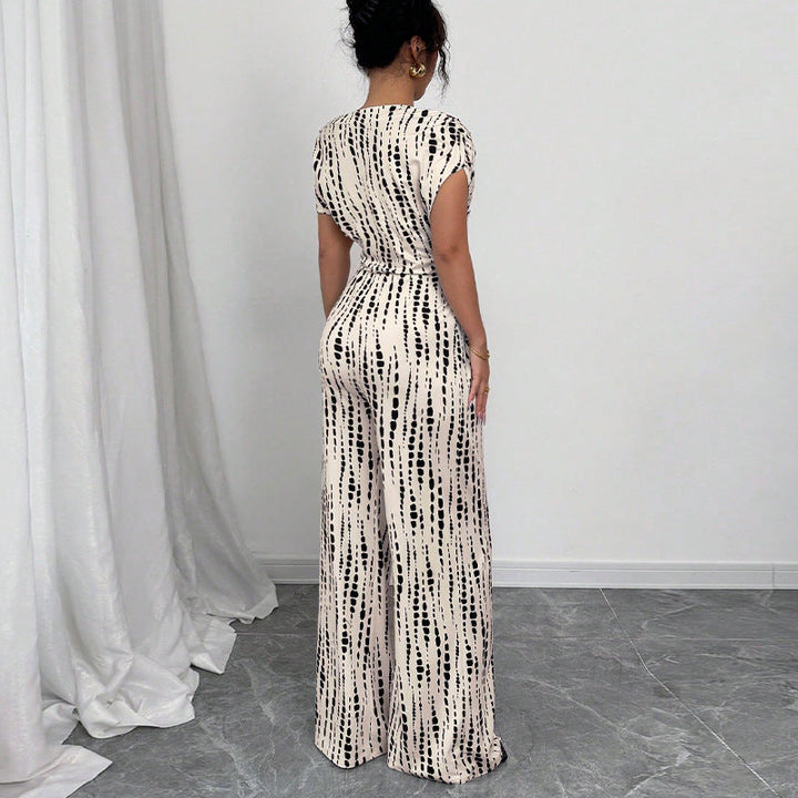 Stylish women's one-shoulder printed jumpsuit. Features a wide leg and belt, ideal for special occasion fashion.