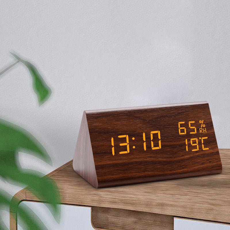 Modern wooden digital desktop clock with clear LED display, temperature, and light control for minimalist bedroom decor.
