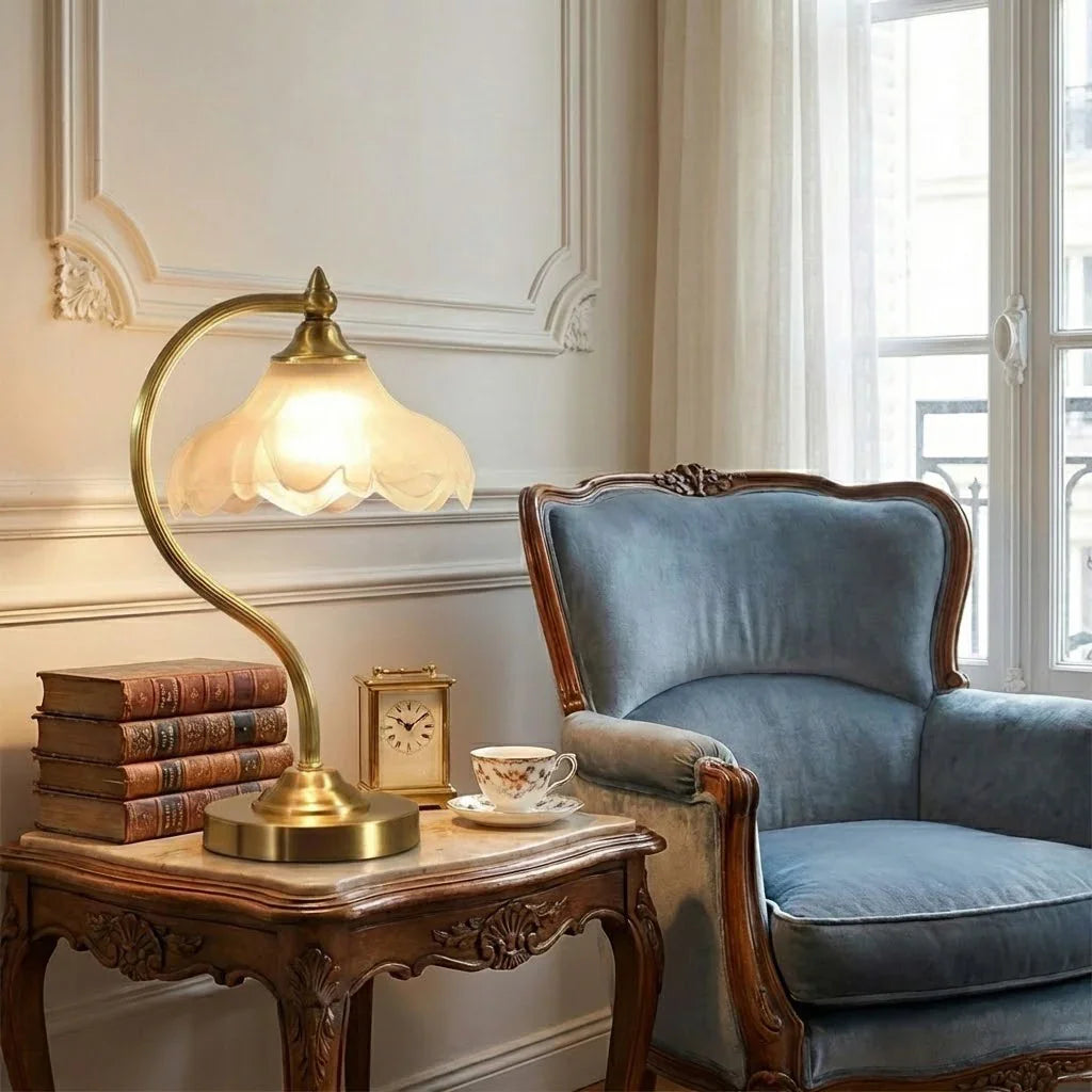 Decorative glass table lamp with elegant floral motifs & adjustable brightness for any room.