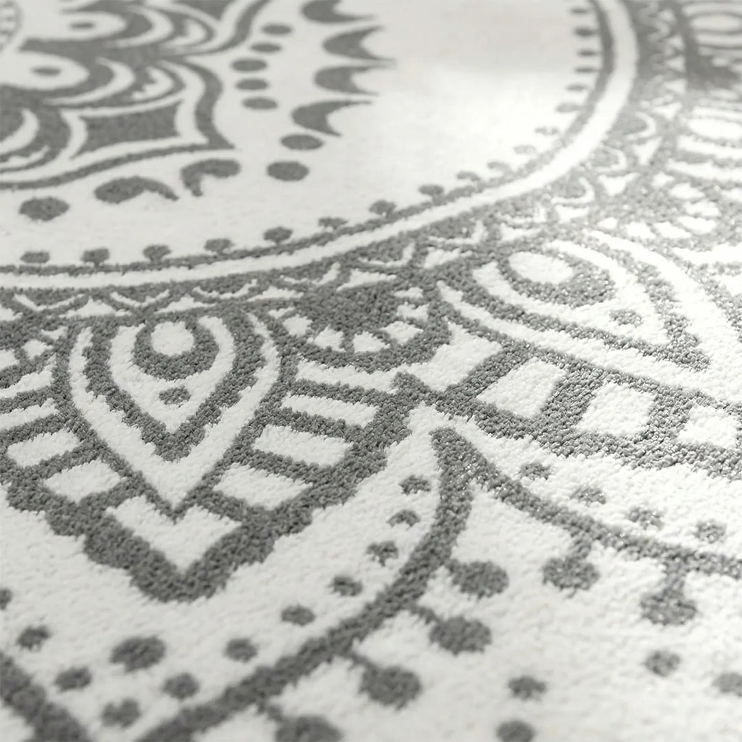 Decorative round bohemian rug featuring a unique Flowique wave design. Ideal accent area rug for stylish home interiors.