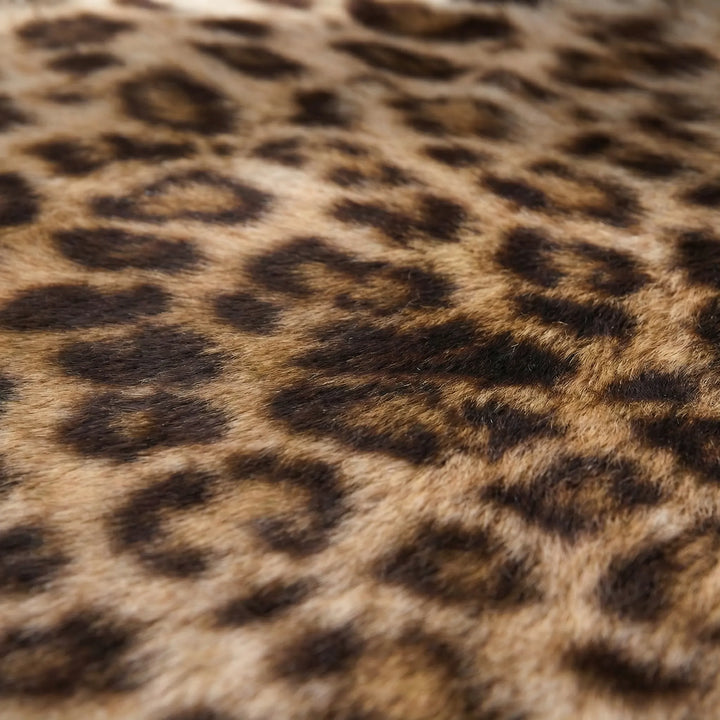 Statement round leopard print area rug. Unique patterned soft accent rug for contemporary home decor.