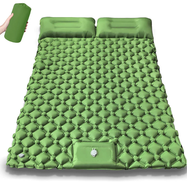 Two dual camping air beds side-by-side. Group camping setup with comfortable inflatable mattresses.