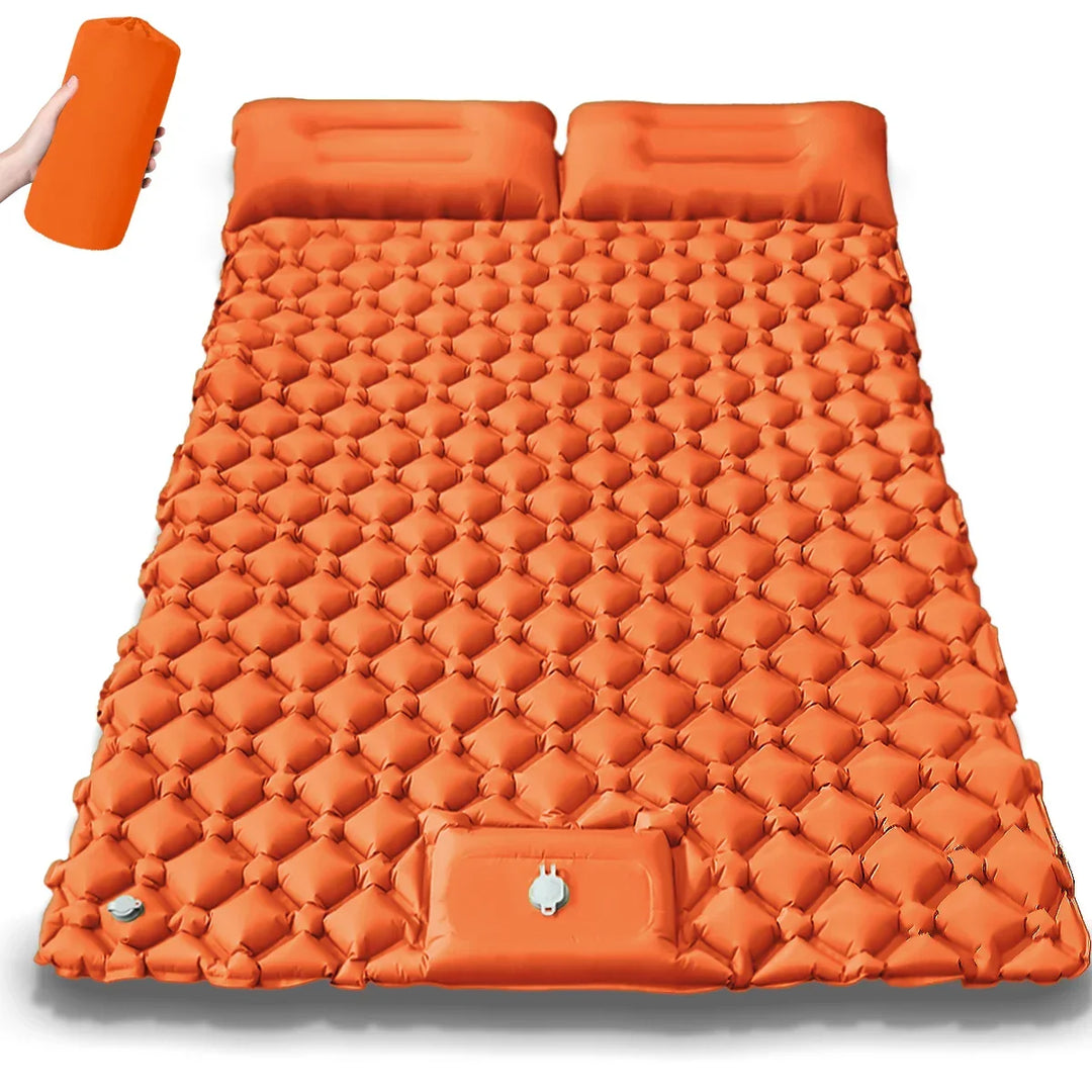 Unisex dual air bed for camping with integrated pump. Comfortable inflatable mattress, portable for outdoor adventures.