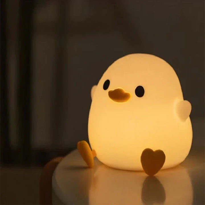Cute silicone kids' night light, rechargeable & soft, providing comforting LED light for children's bedrooms.