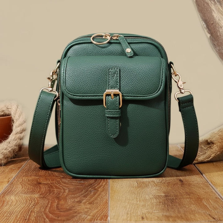 Green unisex anti-theft shoulder bag with adjustable strap. Perfect compact travel or daily bag.