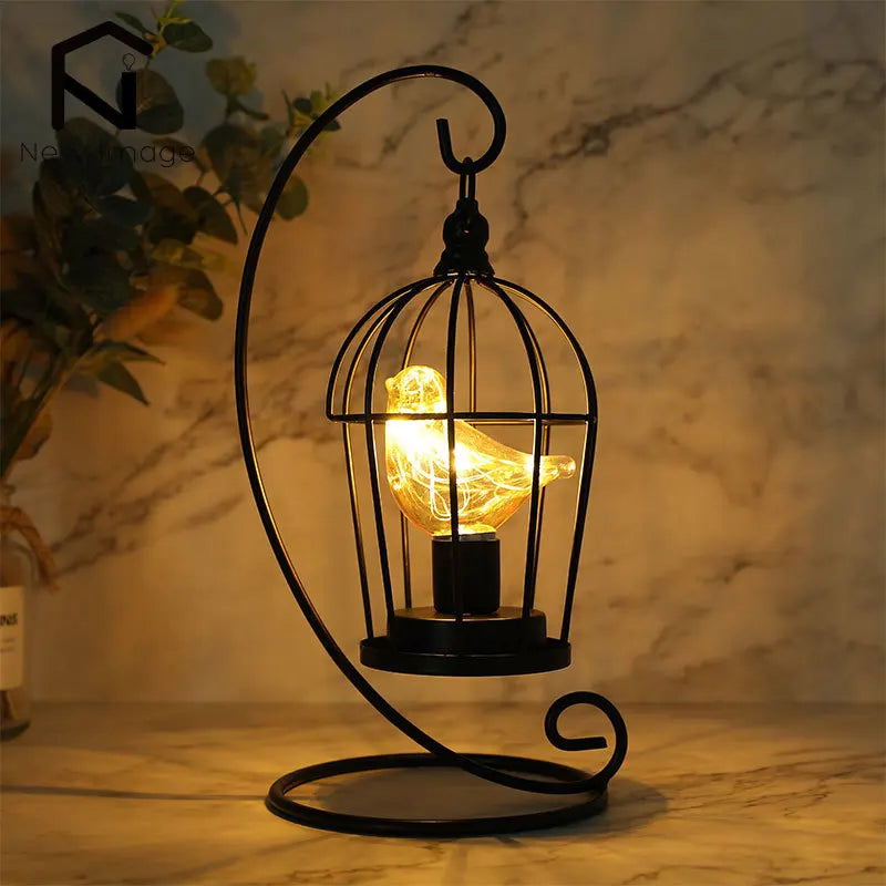 Cordless birdcage LED table lamp with enchanting fairy lights for cozy home decor.