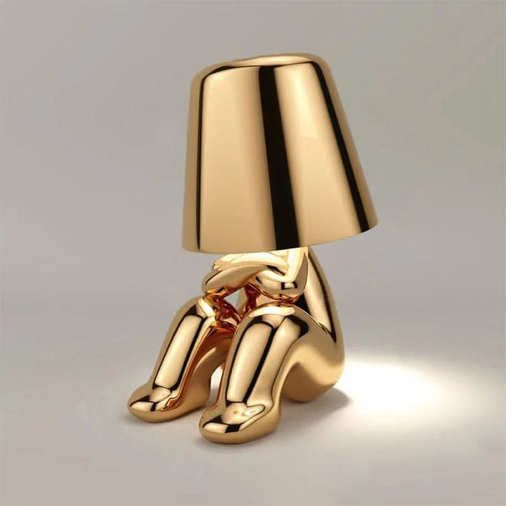 Minimalist gold LED table lamp, a sleek modern design for contemporary interior spaces.