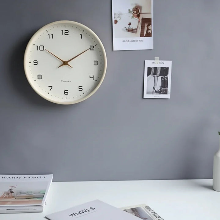 Minimalist Scandinavian wooden wall clock in beige, perfect for modern home decor. Silent quartz movement.