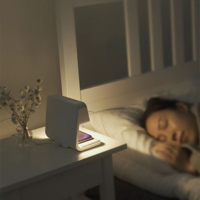Compact 3-in-1 LED lamp with touch-sensitive light, wireless charger, & digital alarm clock. Modern design.