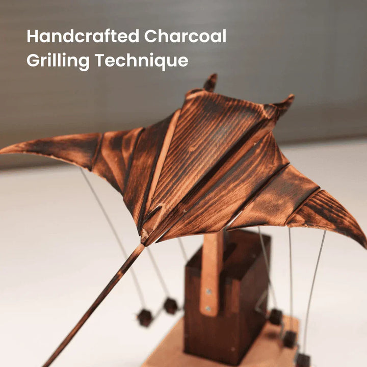Detailed wooden automaton manta ray desk sculpture, hand-cranked mechanical art, a unique gift for ocean lovers.