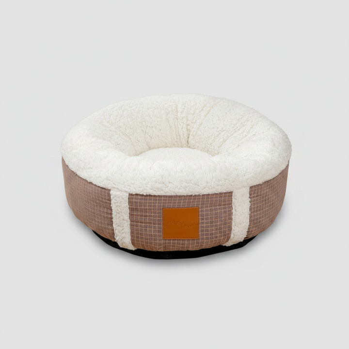 Plush, super-soft pet bed for cozy winter sleep. Washable calming dog & cat nest, ideal for indoor small pets.