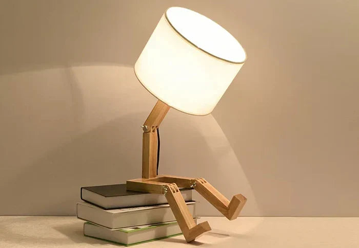 Stylish adjustable wooden desk lamp with fabric shade & built-in storage. Enhance your home office lighting.