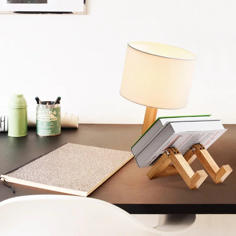 Elegant adjustable wooden table lamp with natural wood finish, fabric shade, and integrated storage.