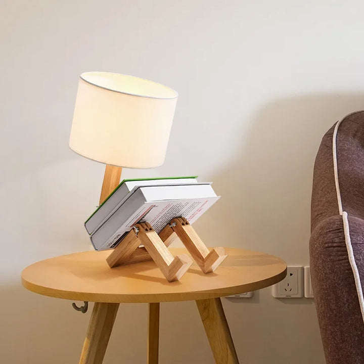 Space-saving adjustable wooden desk lamp with a fabric shade and convenient storage for office essentials.