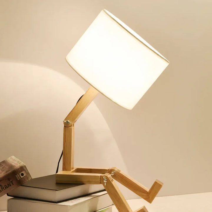 Unique adjustable wooden lamp with movable arm, fabric shade & base storage. Modern lighting for any room.