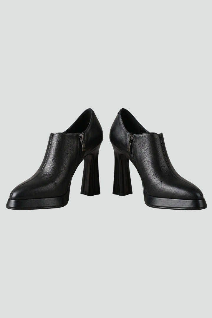 Women's elevated platform pumps with a stylish side zipper & comfortable block heel.