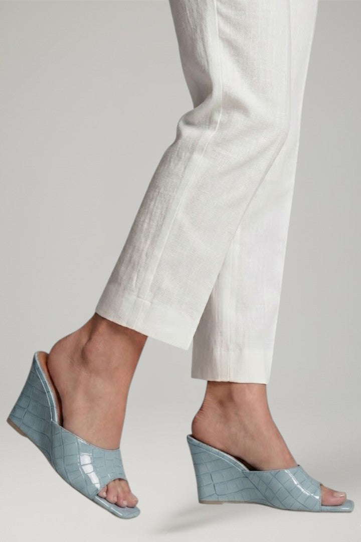 Sophisticated nude women's wedge shoes, featuring a comfortable cushioned sole and elegant summer design.