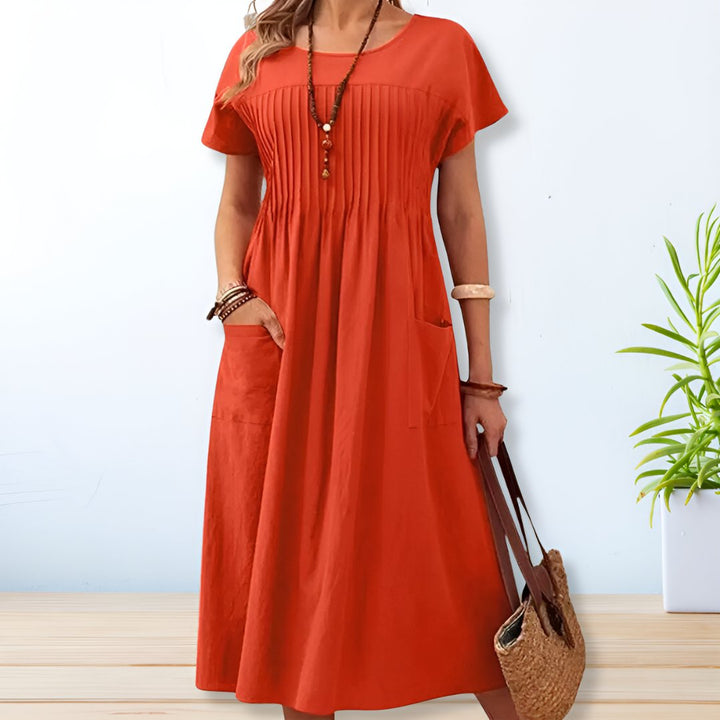 Stylish women's relaxed fit midi dress, ideal for effortless everyday wear or a comfortable weekend outfit.