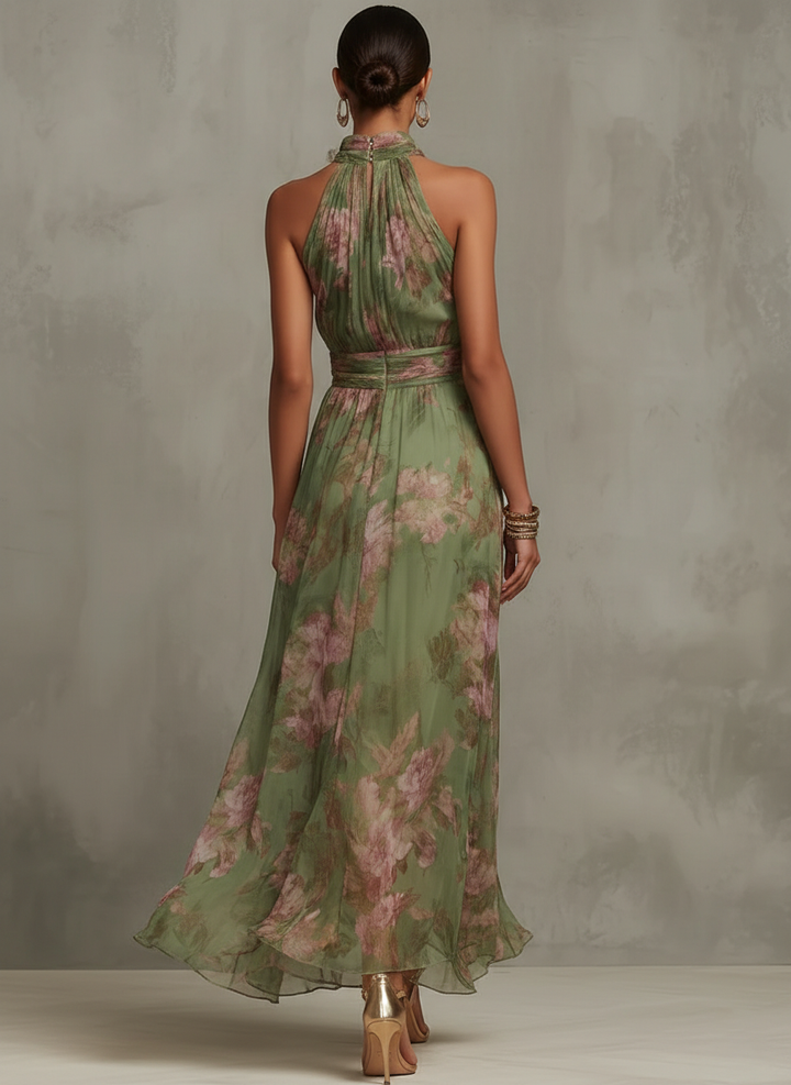 Women's sleeveless flowy maxi dress with an elegant halter neckline, ideal for warm summer days.