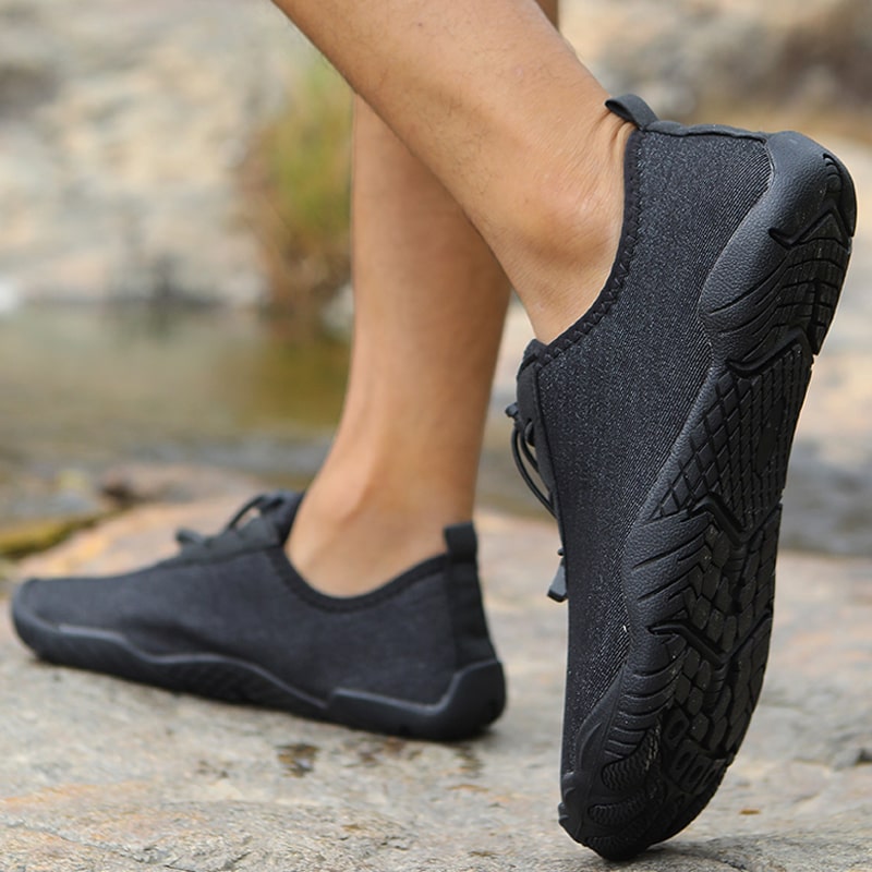 Minimalist outdoor barefoot shoes with non-slip grip for natural ground feel.