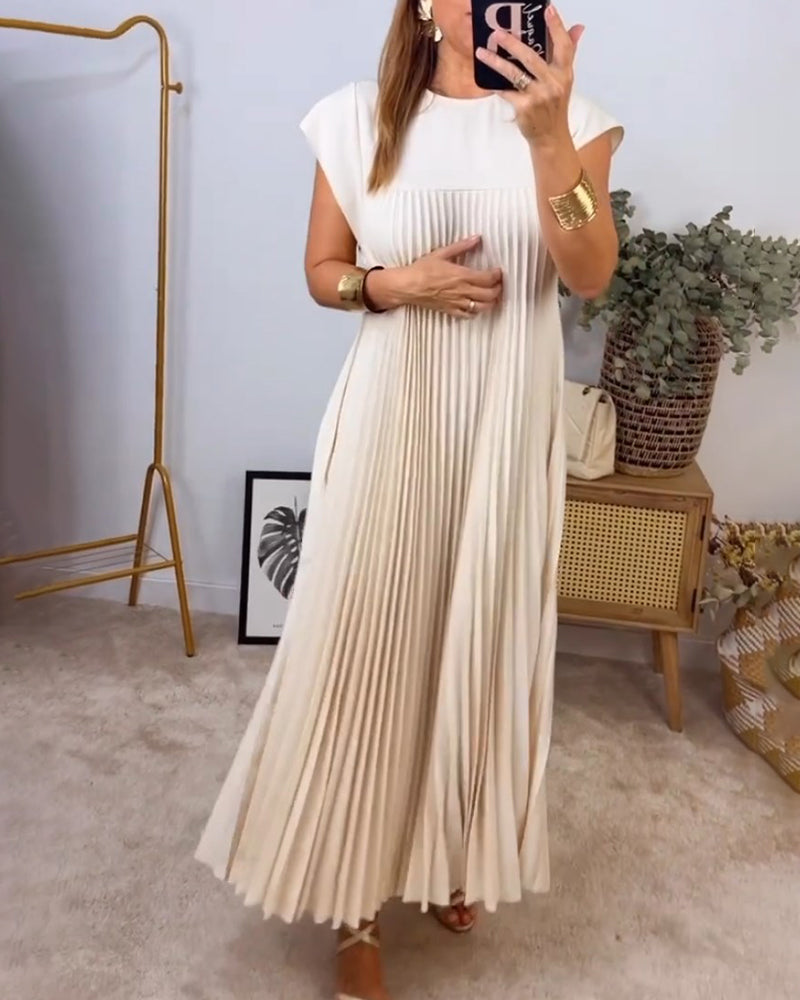 Flat lay of a women's flowing pleated maxi dress, showcasing its elegant design, comfortable fabric & versatile appeal.