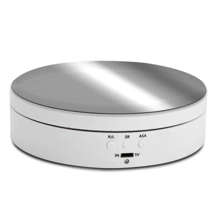 "Black electric motorized rotating display stand, round base, showcasing 360° rotation for professional photography setups."