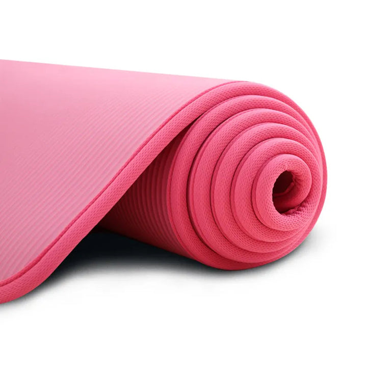 Pink extra thick, comfortable non-slip exercise mat for yoga, Pilates, and home fitness. Durable joint support.