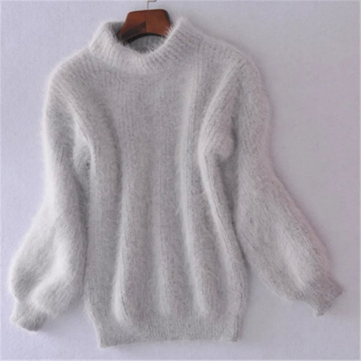 Fashionable women's round neck long sleeve sweater. Cozy knit pullover, ideal for stylish fall outfits.