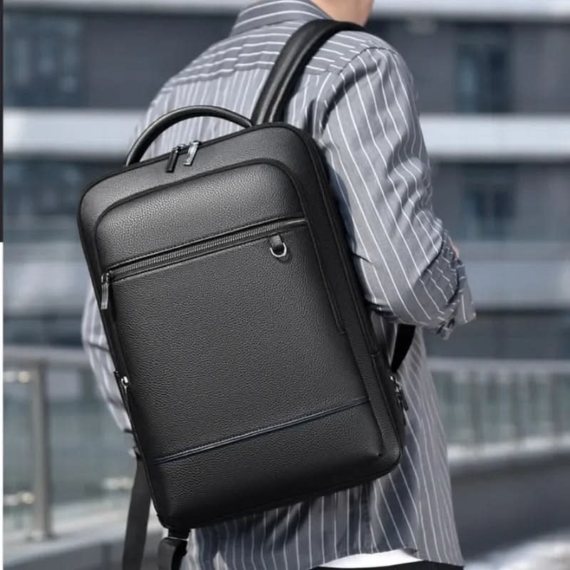 Modern black smart backpack with USB charging, designed for urban professionals & daily commute needs.