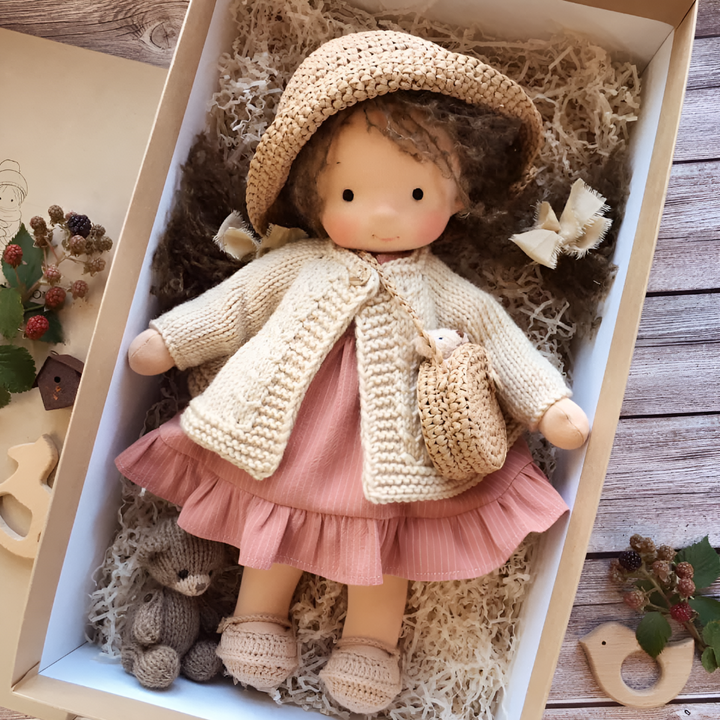 Soft Waldorf doll with simple features, encouraging imaginative play & creativity.