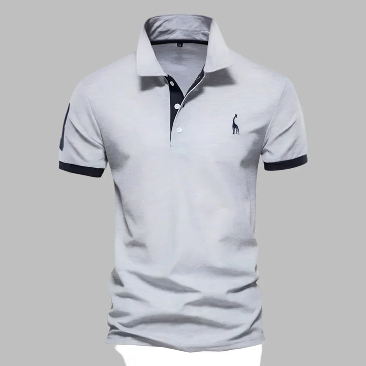 Smart men's polo shirt featuring contemporary contrast trim, short sleeves, suitable for various occasions.