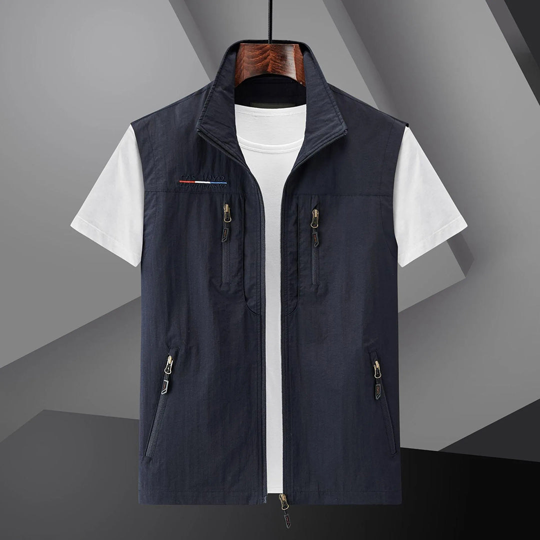 Men's lightweight adventure utility vest with multiple pockets for outdoor activities & travel.
