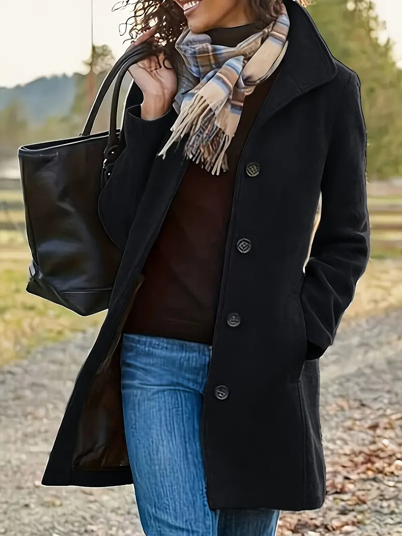 Fashionable women's button-front trench coat with a chic lapel. Tailored mid-length design for elegant fall/winter wear.