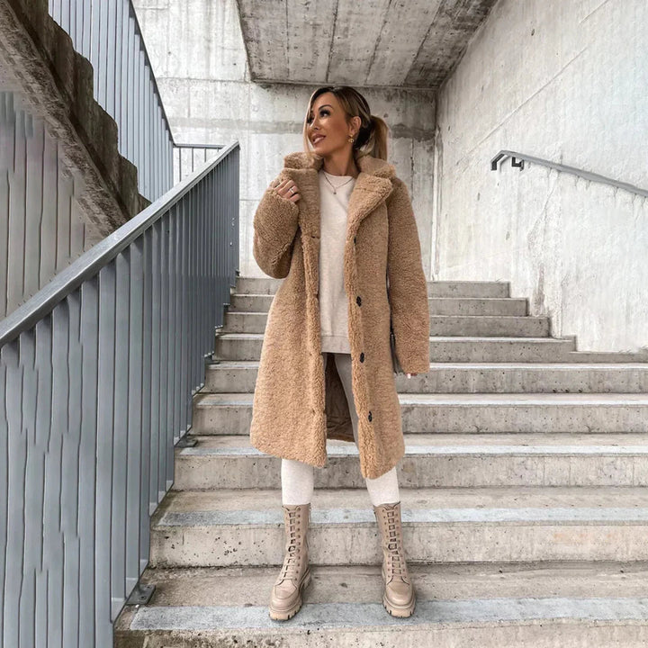 Soft & cozy women's long teddy coat, ideal for casual fall & winter fashion. Warm outerwear with a stylish button closure.