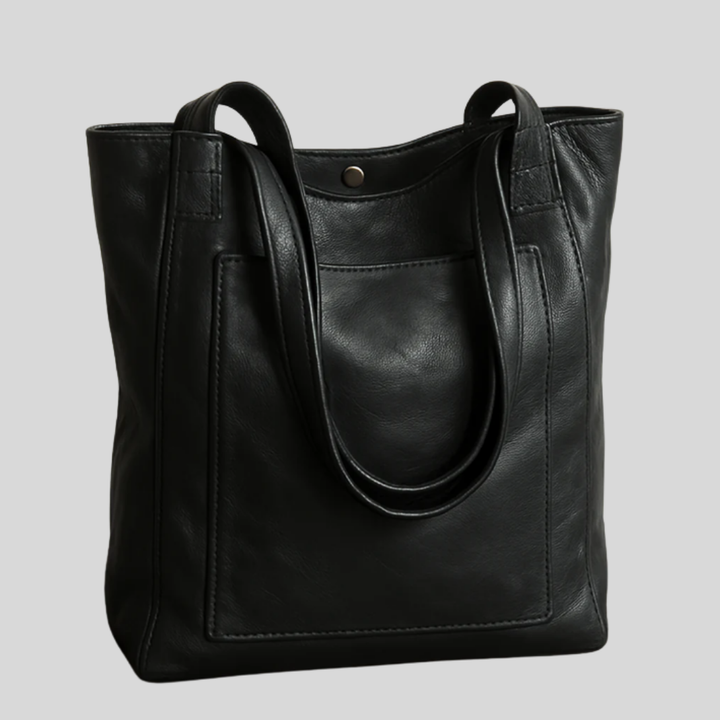 Sophisticated women's elegant tote bag. Offers organized storage and an adjustable strap for cross-body or shoulder carry.