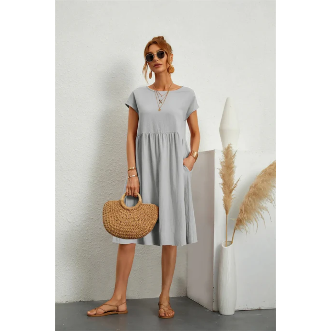 Stylish women's summer midi dress featuring cap sleeves, A-line silhouette, and essential pockets.
