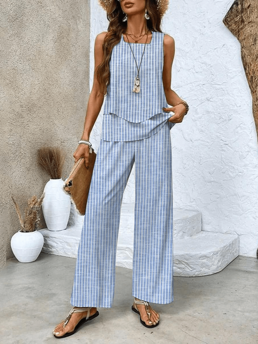 Stunning women's summer outfit: two-piece set with a loose flowy top and fashionable wide-leg pants.