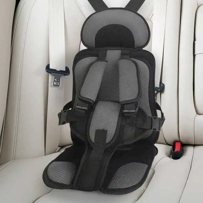 "Child safety car cushion seat in bright red with comfy padding and adjustable straps for secure, cozy travel."