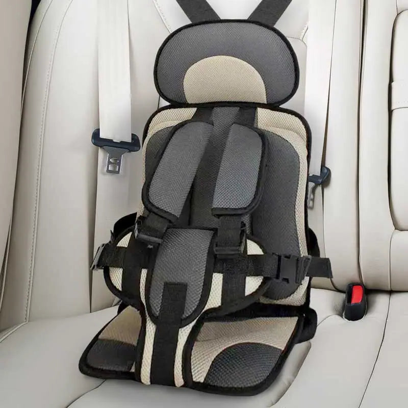"Child safety car cushion seat in bright red with comfy padding and adjustable straps for secure, cozy travel."