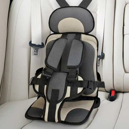 "Child safety car cushion seat in bright red with comfy padding and adjustable straps for secure, cozy travel."