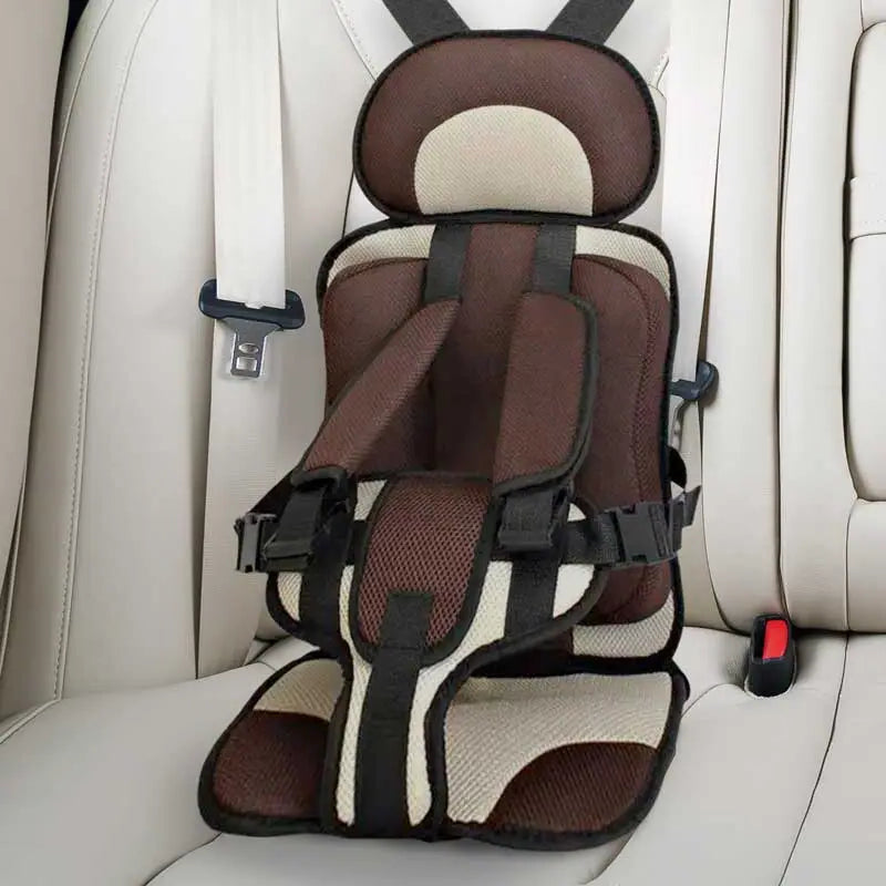 "Child safety car cushion seat in bright red with comfy padding and adjustable straps for secure, cozy travel."
